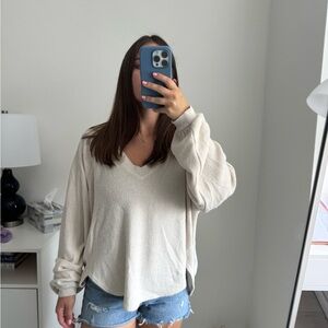Cream and white V-neck long sleeve sweater from Urban Outfitters